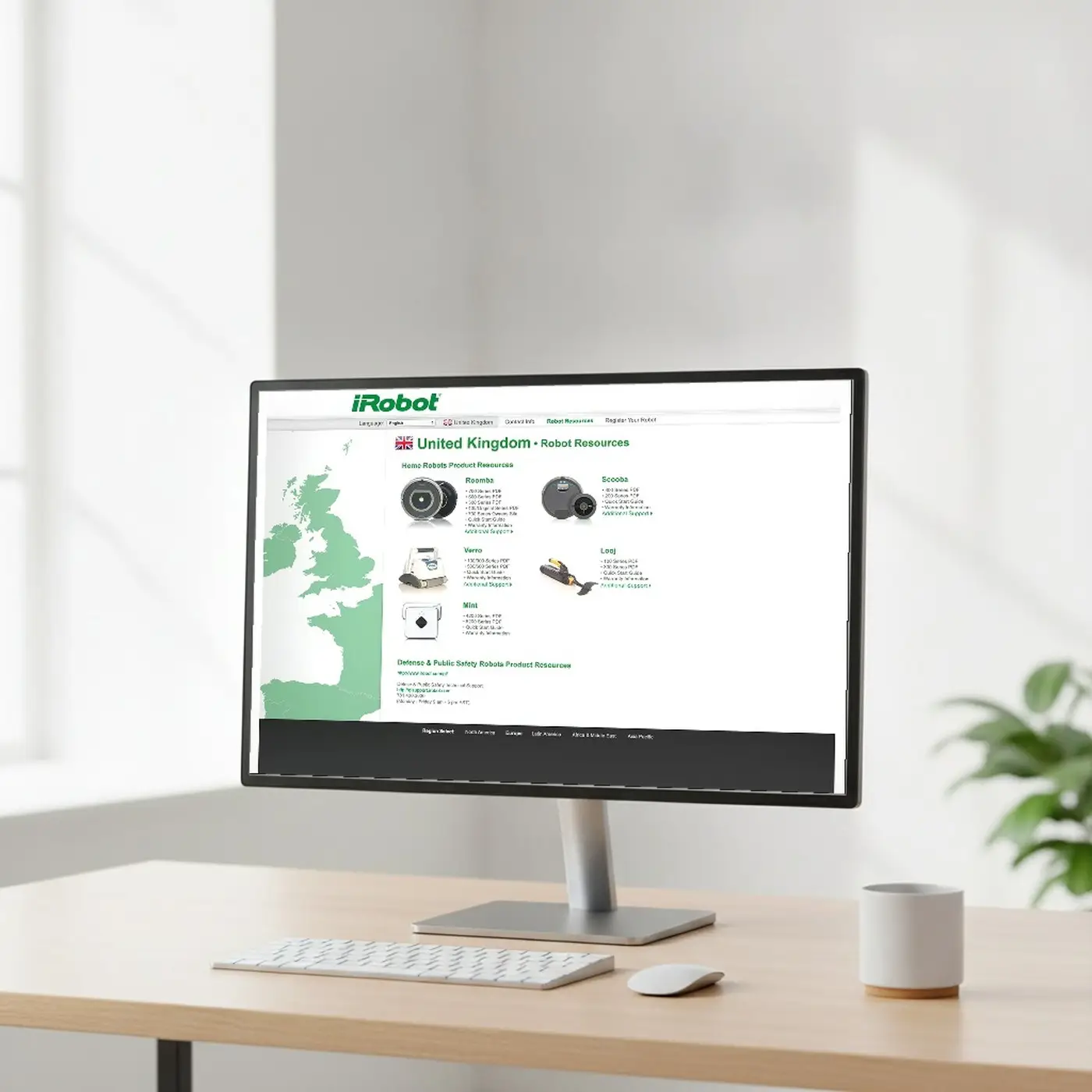 Archived capture of iRobot.com's United Kingdom Robot Resources page, composited onto a desk monitor